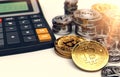 Piles of Bitcoin, other cryptocurrencies and a calculator. Fees and taxes on cryptocurrency investments. 3D rendering