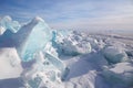 Piles of blue ice fragments covered in snow. Frozen Lake Baikal on a sunny winter day Royalty Free Stock Photo