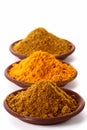Piles of bright Curry Powder and tumeric