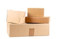 Piles of brown used cardboard boxes on a white background Royalty Free Stock Photo