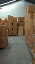 Piles of cardboard packages that fill the warehouse space2