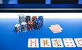 Piles of chips and Texas Hold `em poker cards Royalty Free Stock Photo