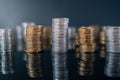 Piles of coins (polish zloty, grosze, PLN) on a black, reflective surface. Royalty Free Stock Photo