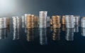 Piles of coins (polish zloty, grosze, PLN) on a black, reflective surface. Royalty Free Stock Photo