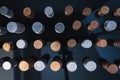 Piles of coins (polish zloty, grosze, PLN) on a black, reflective surface seen from the top. Royalty Free Stock Photo