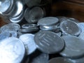 piles of coins scattered on the floor