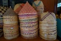 Piles of colorful cone shape and round shape Thai handicraft woven bamboo dishes cover to prevent food from insects such as flies