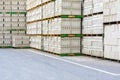 Piles of concrete blocks on wooden pallets stacked outdoors Royalty Free Stock Photo