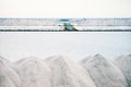 Piles of crystallised salt at a saline refinery Royalty Free Stock Photo