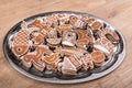 Traditional Christmas gingerbreads of various shapes on a wood table Royalty Free Stock Photo