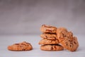 Piles of delicious chocolate chip cookies on a white plate with a milk bottle. Pastry utensils with white linen napkins on a woode Royalty Free Stock Photo