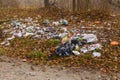 Different garbage on a ground in forest