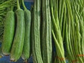 Piles of Fresh Green Vegetables for Sale at Market Stall