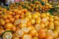 piles of fresh kumquats on display at a city market Royalty Free Stock Photo