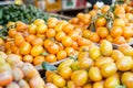 piles of fresh kumquats on display at a city market Royalty Free Stock Photo