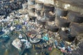 piles of garbage floating on the seafront or waters