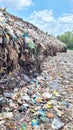 Piles of garbages on dumpsite Royalty Free Stock Photo