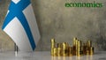 Piles of gold coins on a marble table against the background of the flag of Finland.