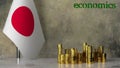 Piles of gold coins on a marble table against the background of the flag of Japan.