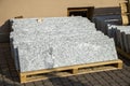 Piles of granite marble slabs. Stone sheets for decorative construction