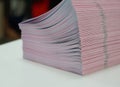 Piles of handout papers placed on table Royalty Free Stock Photo