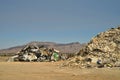 Piles of household junk at refuse management dump in Mojave Desert mountains valley town Pahrump, Nevada, USA