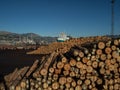 Piles of industrial lumber and boats by the harbour, Lyttleton, New Zealand