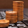 Piles of Japanese 10 yen coins are on the black keyboard of a computer or laptop. Illustration: online trading, payments and Royalty Free Stock Photo