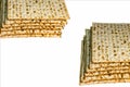 Piles of Jewish Matzah bread, substitute for bread on the Jewish Passover holiday. Pesach matzo on white background Royalty Free Stock Photo