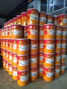 Piles of Jotun brand paint cans.