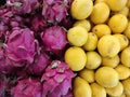 Piles of lemon and dragon fruits in the store