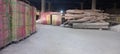 Piles of logs and granite on the Basement floor