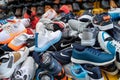 New Delhi, India - November 17, 2019: Piles of mens knock off designer tennis shoes for sale in Nehru Place market in South Delhi