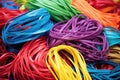 piles of newly produced multicolored elastic bands