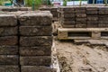 Piles of paving stones on pallets, construction industry background