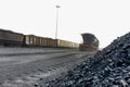 Coal next to a rail siding waiting to be put on a train Royalty Free Stock Photo