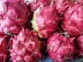 Piles of red dragon fruit at a traditional market in Jakarta