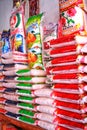 piles of rice in small and medium-sized sacks, as staple food at a rice shop near Jakarta