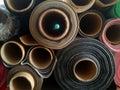 Piles of rolls of textile fabrics of various colors Royalty Free Stock Photo