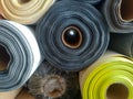 Piles of rolls of textile fabrics of various colors Royalty Free Stock Photo