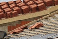 piles of roofing-tiles on a house