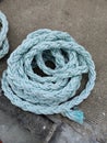 A piles of ropes lying on the floor, Blue Rope