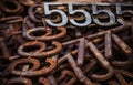 Piles of rusty metal numbers and letters Royalty Free Stock Photo