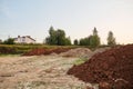 Piles of sand. A heap of building material for bedding or an ingredient for mixing cement. Construction site. Large delivery.