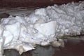 Piles of snow on sidewalk