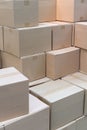 Piles or stacks of paper boxes with goods in storage.