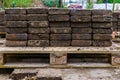 Piles of street paving stacked on a pallet, construction industry background