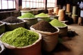 piles of tea leaves in different stages of processing