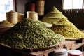 piles of tea leaves in different stages of processing