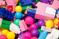 Piles of toys. A lot of colorful toys including balls and plastic construction toys or building blocks, top view. Toy for children Royalty Free Stock Photo